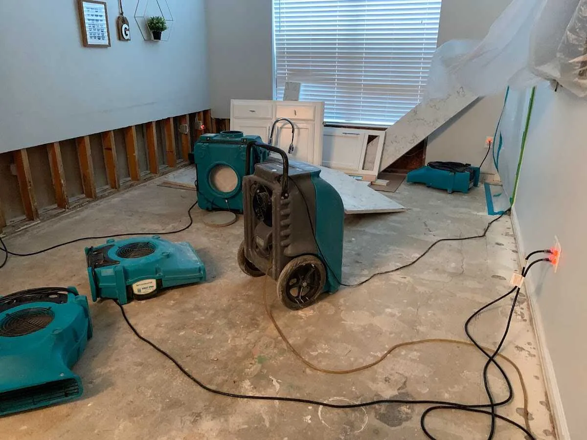 Dehumidifier in flood-cut room for Water Damage Restoration in Burleson
